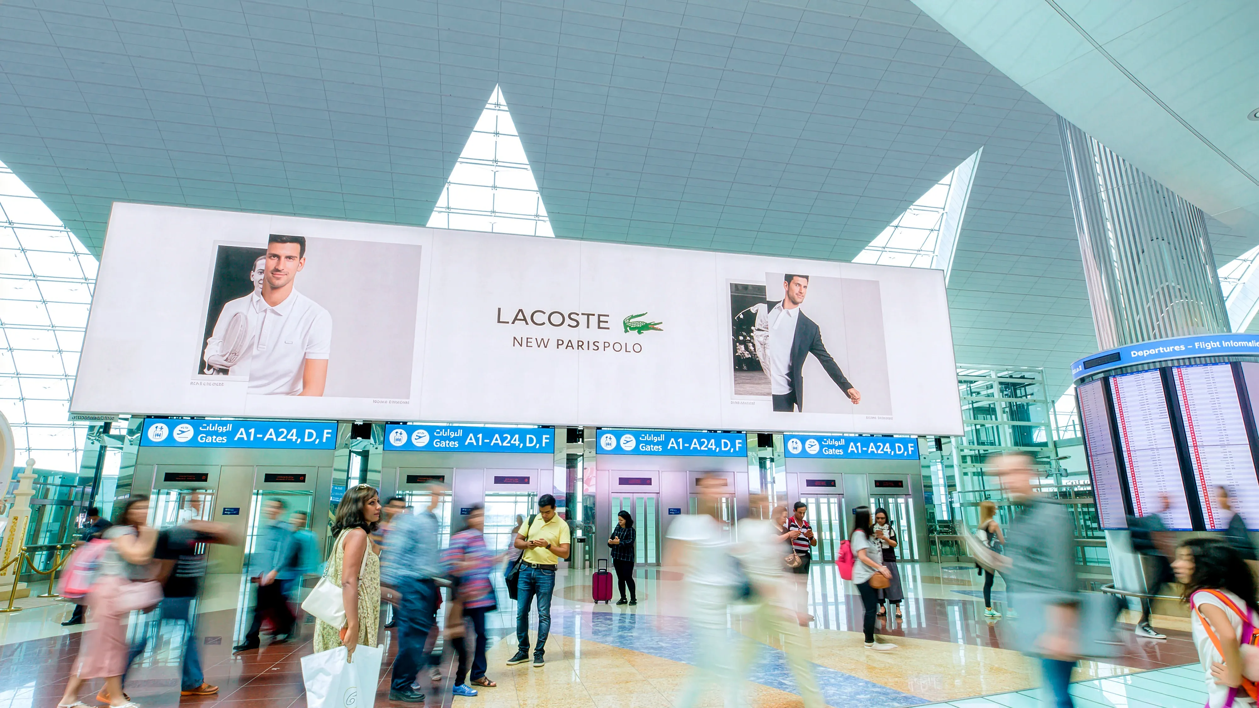 Flydubai in-flight passenger screen advertising AYS Developers inside aircraft cabin — premium captive inflight digital advertising display viewed from business class seat.