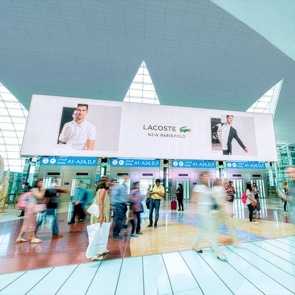 Flydubai in-flight passenger screen advertising AYS Developers inside aircraft cabin — premium captive inflight digital advertising display viewed from business class seat.