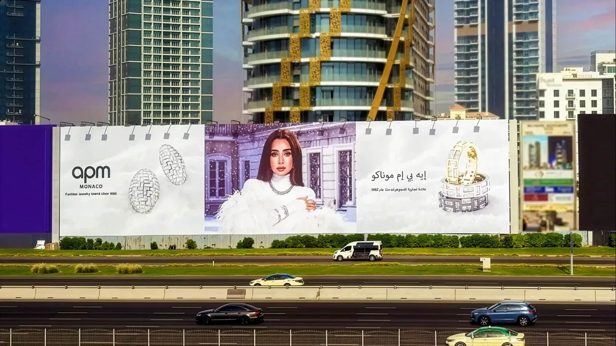 Large roadside billboard advertising for luxury brand APM Monaco on Sheikh Zayed Road, Dubai