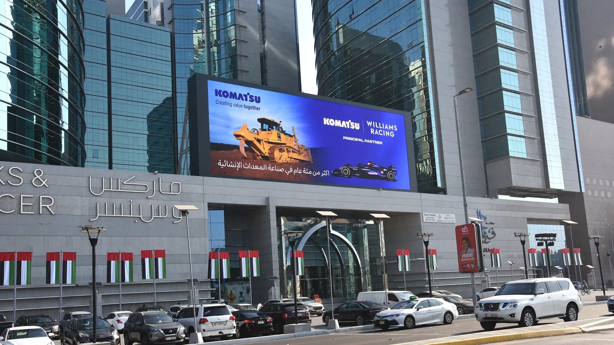 Programmatic DOOH billboard campaign for Komatsu displayed in a high-traffic area, World Trade Centre, Dubai